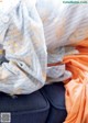 A pile of clothes sitting on top of a couch.